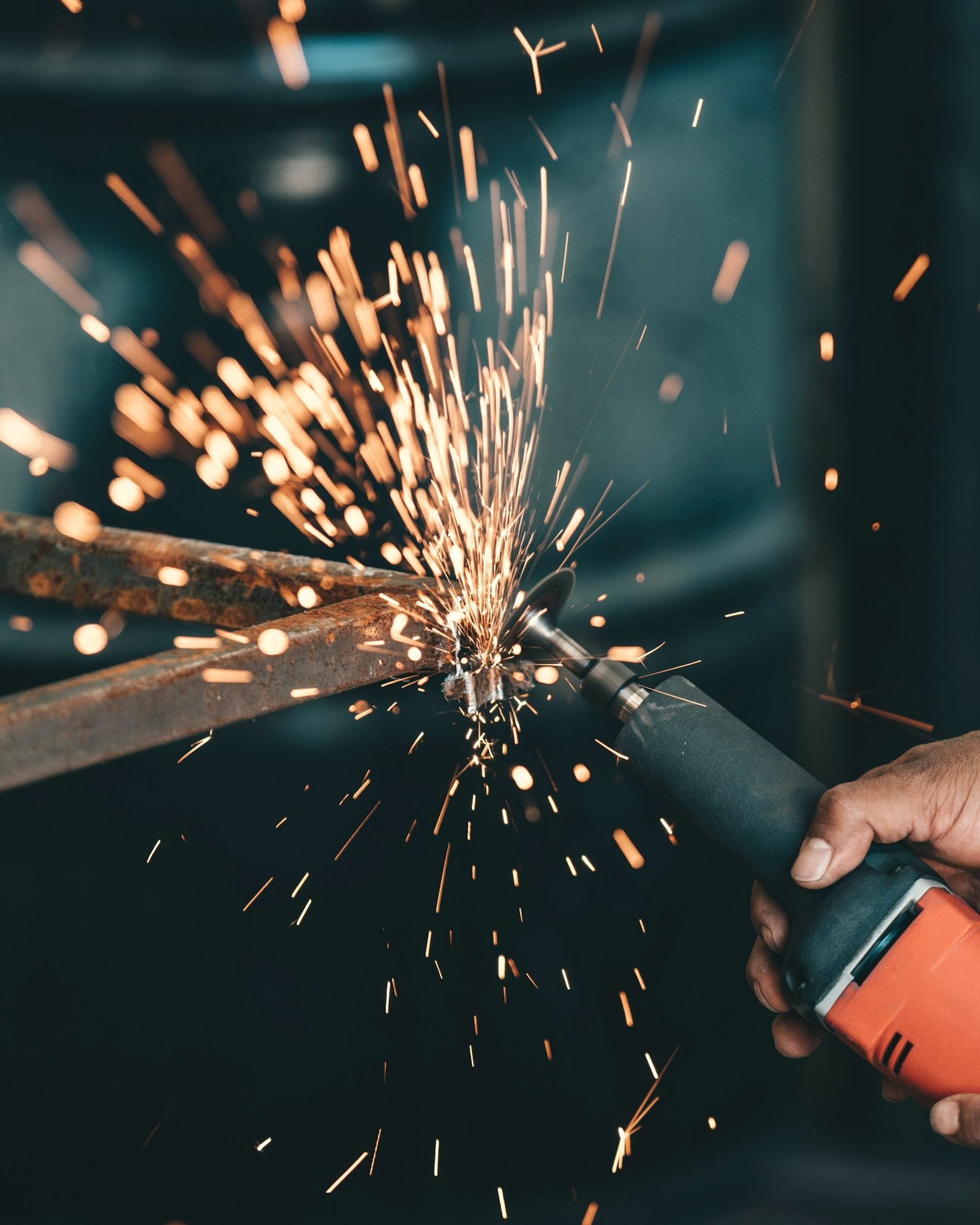 Sparks flying from a grinder cutting steel
